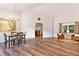 Dining area featuring wood-look floors and plenty of natural light at 9700 Sw 196 Circle, Dunnellon, FL 34432