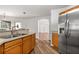 Galley style kitchen with stainless steel appliances and wood cabinets at 9700 Sw 196 Circle, Dunnellon, FL 34432