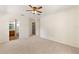 Spacious main bedroom with ceiling fan and two door ways at 9700 Sw 196 Circle, Dunnellon, FL 34432