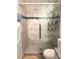 Updated bathroom with a glass-enclosed shower, marble tile surround, and modern fixtures at 15094 Sw 43Rd Avenue Rd, Ocala, FL 34473