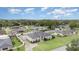 Aerial view of home with well-manicured lawn and mature trees at 629 Orange Valley Ln, Lakeland, FL 33813