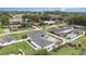 Aerial view of home with well-manicured lawn, mature trees, and pool at 629 Orange Valley Ln, Lakeland, FL 33813