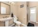 Traditional bathroom with a pedestal sink, toilet, and walk-in shower at 629 Orange Valley Ln, Lakeland, FL 33813