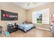 Light and airy bedroom with a window and features a ceiling fan and wood-look flooring at 629 Orange Valley Ln, Lakeland, FL 33813