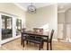 Cozy dining area with a wooden table, comfortable seating, and bright natural light at 629 Orange Valley Ln, Lakeland, FL 33813