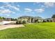 Attractive single-Gathering home with a well-kept lawn and a paved driveway leading to the front entrance at 629 Orange Valley Ln, Lakeland, FL 33813