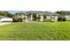 Charming one-story home featuring a well-maintained lawn, mature trees, and inviting curb appeal at 629 Orange Valley Ln, Lakeland, FL 33813