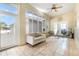 Sunroom with a cream sofa and lots of natural light from the many windows at 629 Orange Valley Ln, Lakeland, FL 33813
