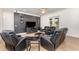 Modern living room with sleek black furniture, a dark accent wall, and stylish decor at 629 Orange Valley Ln, Lakeland, FL 33813