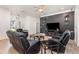 Contemporary living room with stylish furniture, a black accent wall, and an open layout at 629 Orange Valley Ln, Lakeland, FL 33813