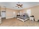 Spacious primary bedroom with ceiling fan, wood floors, and natural light at 629 Orange Valley Ln, Lakeland, FL 33813