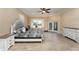 Spacious main bedroom boasts lots of natural light, light wood flooring, and neutral color palette at 629 Orange Valley Ln, Lakeland, FL 33813