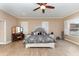 Large bedroom with wood floors, shuttered windows, and a ceiling fan at 629 Orange Valley Ln, Lakeland, FL 33813