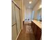 Bathroom with a walk-in shower, tub, and vanity with dual sinks, all complemented by tile flooring at 12064 Navale Ln, Orlando, FL 32827