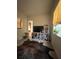 Comfortable living room area featuring a television, shelving, and a faux cowhide rug at 12064 Navale Ln, Orlando, FL 32827