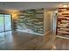 Spacious living room featuring unique accent walls and a sliding glass door at 2123 Woodburn S Loop, Lakeland, FL 33813