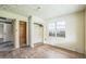 This bedroom includes an original closet, a vintage ceiling and natural light from a window at 303 Clayton Rd, Auburndale, FL 33823
