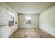 A bedroom with brick accent wall and two windows, ready for renovation and new touches at 303 Clayton Rd, Auburndale, FL 33823