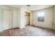 A bedroom with closet and a window, presenting a blank canvas for customization and design at 303 Clayton Rd, Auburndale, FL 33823