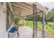 A covered front porch with decorative ironwork offers an outdoor space at 303 Clayton Rd, Auburndale, FL 33823