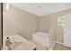 Well-lit bathroom with soaking tub, vanity, tiled flooring, and large window at 3826 Sleepy Hill Oaks Loop, Lakeland, FL 33810