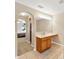 Accessible bathroom featuring a vanity with roll-under sink, tiled flooring, and a bright ambiance at 3826 Sleepy Hill Oaks Loop, Lakeland, FL 33810