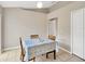 Cozy dining area featuring tile floors, natural light, and a simple table set for intimate meals at 3826 Sleepy Hill Oaks Loop, Lakeland, FL 33810