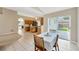 Bright dining area with a patio view, seamlessly connected to the modern kitchen at 3826 Sleepy Hill Oaks Loop, Lakeland, FL 33810