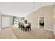 Spacious dining room with seating for ten, carpet, and a chandelier above the table at 3826 Sleepy Hill Oaks Loop, Lakeland, FL 33810