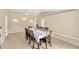 Traditional dining room showcasing a large table with seating for ten and elegant wall sconces at 3826 Sleepy Hill Oaks Loop, Lakeland, FL 33810