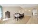 Formal dining room with a chandelier, neutral colors and dining table set for ten at 3826 Sleepy Hill Oaks Loop, Lakeland, FL 33810