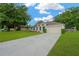 Single-story home featuring manicured lawn, an inviting driveway, and a two car garage at 3826 Sleepy Hill Oaks Loop, Lakeland, FL 33810