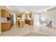 Spacious kitchen featuring stainless steel appliances, center island, and ample counter space at 3826 Sleepy Hill Oaks Loop, Lakeland, FL 33810