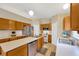 Spacious kitchen with oak cabinets, white countertops, stainless steel appliances, and double sink at 3826 Sleepy Hill Oaks Loop, Lakeland, FL 33810