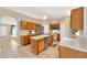 Modern kitchen with stainless steel appliances, including dishwasher, large island, and oak cabinets at 3826 Sleepy Hill Oaks Loop, Lakeland, FL 33810