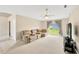 Comfortable living area with a large window, a recliner, and a ceiling fan at 3826 Sleepy Hill Oaks Loop, Lakeland, FL 33810