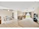 Open-concept living area with tile flooring, plush seating, ceiling fan, and abundant natural light at 3826 Sleepy Hill Oaks Loop, Lakeland, FL 33810