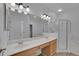 Bright bathroom with double sink vanity and a glass enclosed shower at 3897 Beacon Ridge Way, Clermont, FL 34711