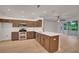 Well-equipped kitchen with stainless steel appliances and wood cabinets at 3897 Beacon Ridge Way, Clermont, FL 34711