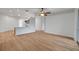 Bright living room with adjacent kitchen area at 3897 Beacon Ridge Way, Clermont, FL 34711