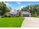 Charming brick home with well-manicured lawn and mature landscaping at 722 Swaying Palm Dr, Apopka, FL 32712