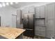 Modern kitchen with stainless steel appliances, granite countertops, and wood flooring at 722 Swaying Palm Dr, Apopka, FL 32712