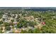 An aerial view of a residential area featuring mature trees, well-maintained homes, and proximity to Wekiva Springs State Park at 722 Swaying Palm Dr, Apopka, FL 32712