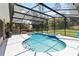 Screened-in kidney shaped pool and spa are ideal for relaxing and entertaining at 722 Swaying Palm Dr, Apopka, FL 32712