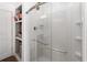 Shower featuring subway tile and built-in shelves at 722 Swaying Palm Dr, Apopka, FL 32712
