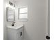 Bathroom featuring a modern vanity, lighting fixtures, and a sleek mirror at 837 E Edgewood Dr, Lakeland, FL 33803