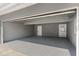 Spacious two car garage with finished walls and ceiling offers ample room for parking and storage at 837 E Edgewood Dr, Lakeland, FL 33803