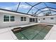Backyard featuring a screened-in pool area, patio, and modern design perfect for relaxing at 837 E Edgewood Dr, Lakeland, FL 33803