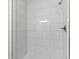 Modern bathroom shower with white subway tile and sleek fixtures at 837 E Edgewood Dr, Lakeland, FL 33803