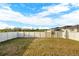 The home's backyard features a lawn and a full fence at 271 Inman Blvd, Winter Haven, FL 33881